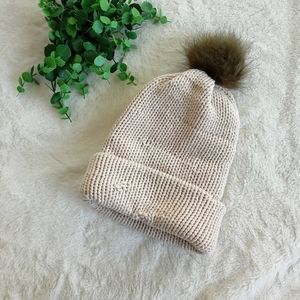 Handmade knit beanie with olive pom pom